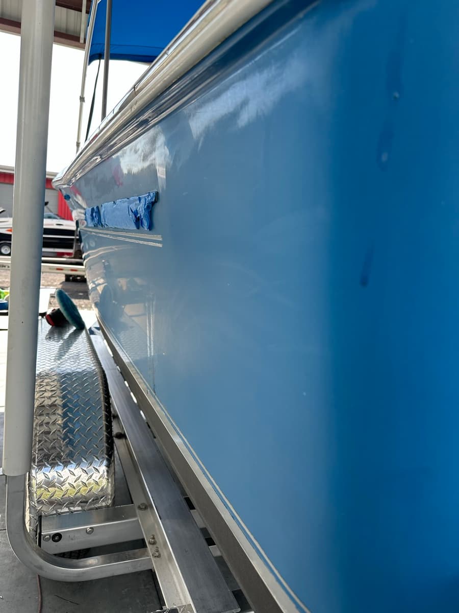 Hull buffing in progress — before